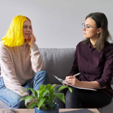 Teen talking to an adult taking notes