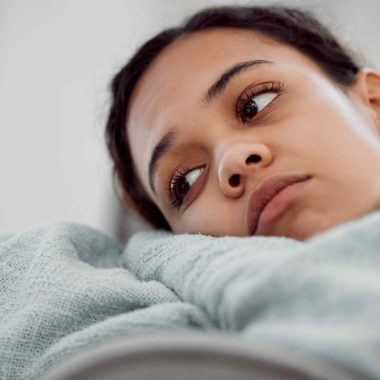 Girl looking glum, looking away from camera