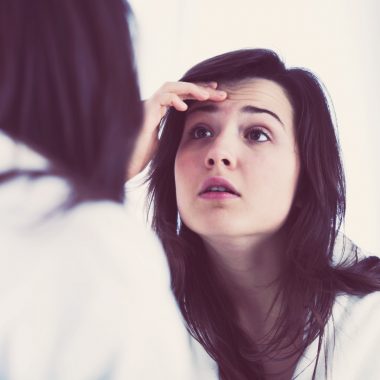 Girl looking in mirror