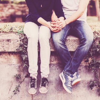 Young couple holding hands