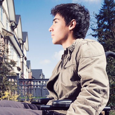 Boy in wheelchair looking up