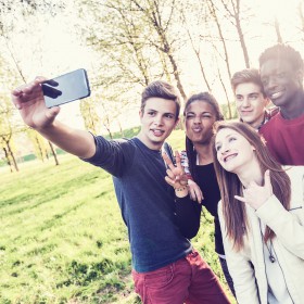 Teenagers taking a selfie