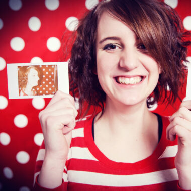 Girl holding photo of herself