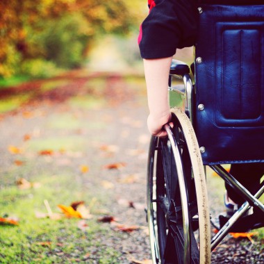 Wheelchair heading down outdoor path