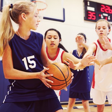 Girls playing basketball