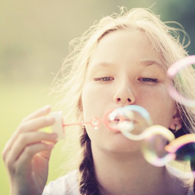 Girl blowing bubbles