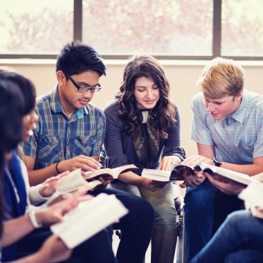 Teenagers reading together