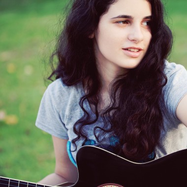 Girl holding a guitar