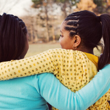 Two girls hugging