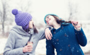 Two girls laughing outside