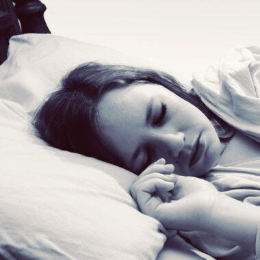 Teen girl asleep in bed