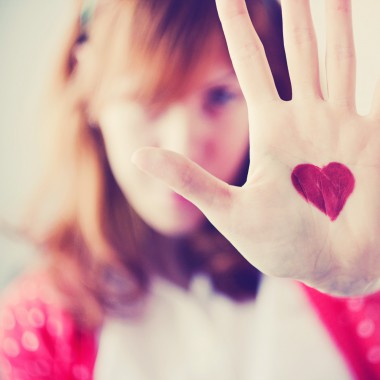 Girl with heart drawn on her hand