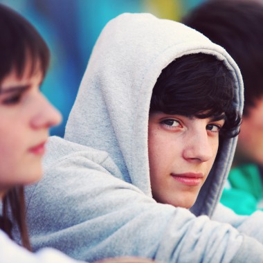 Boy in grey hoodie