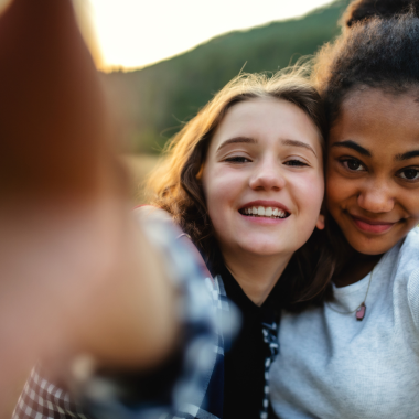 Happy teenagers taking selfie