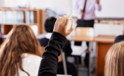 Raised hand in classroom