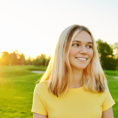 Smiling teenager outdoors